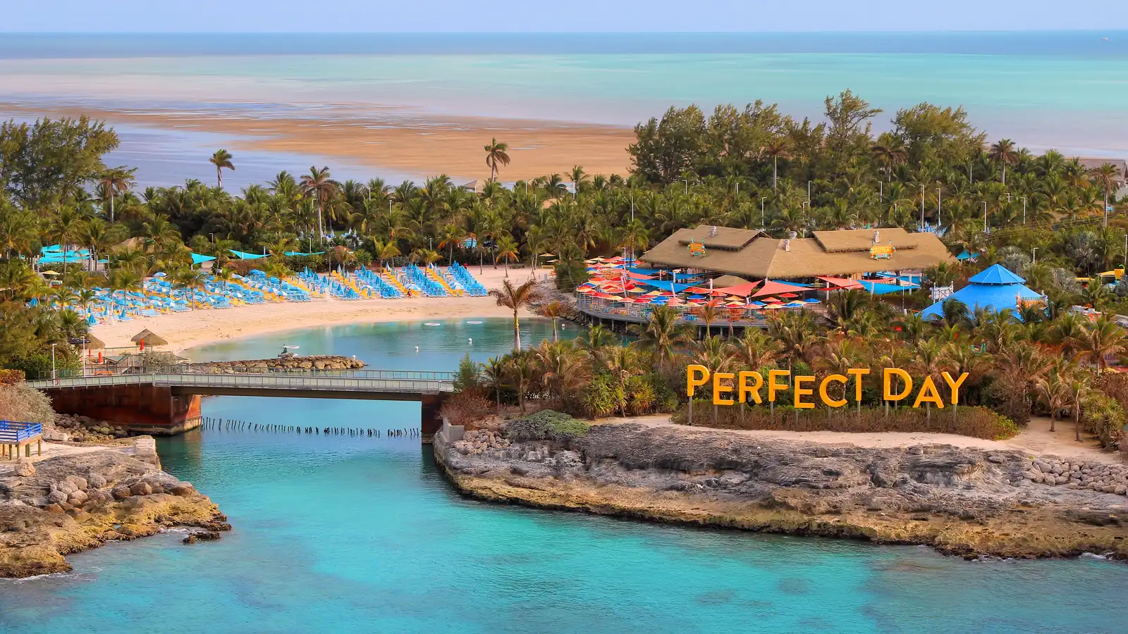Turquoise lagoon, beach and palm trees on a private island in The Bahamas