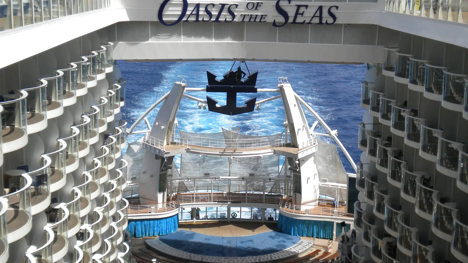 The AquaTheater at the stern of Oasis of the Seas, seen from the Boardwalk, with the ship's wake behind it
